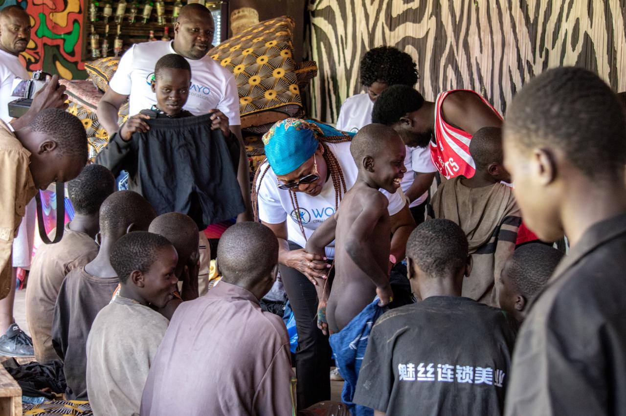 Children receiving supplies and support during a Wolayo distribution activity.